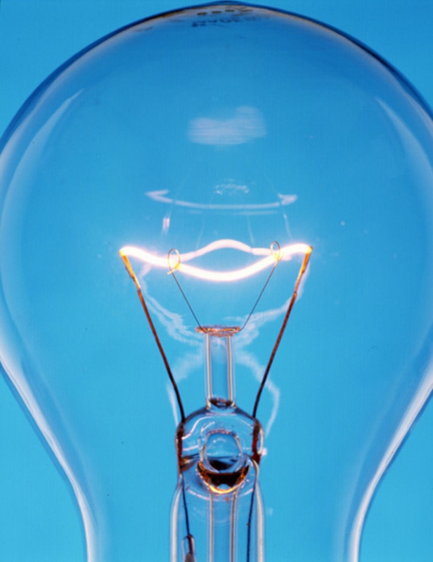 The filament of an incandescent light bulb has high reistance to electric current, which causes it to glow