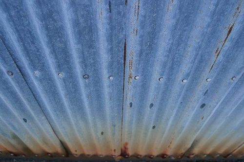 Corrugated steel showing evidence of rusting 