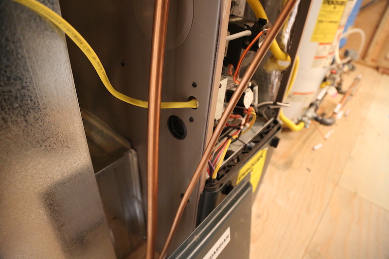 Observation - Electric wiring to the furnace cabinet is not properly installed