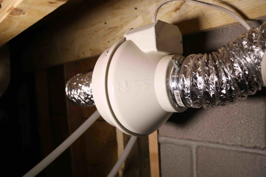 Observation - The radon fan is installed in the crawlspace, directly beneath the conditioned spaces of a building